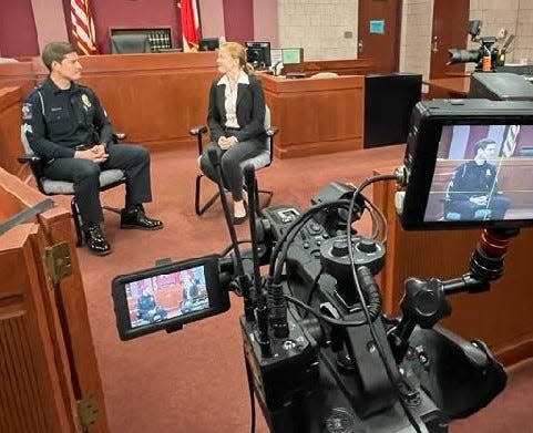 Sgt. James Furlough of the Lexington Police Department talks about police procedures during the filming of a precollege criminal justice online course by Wake Forest University.