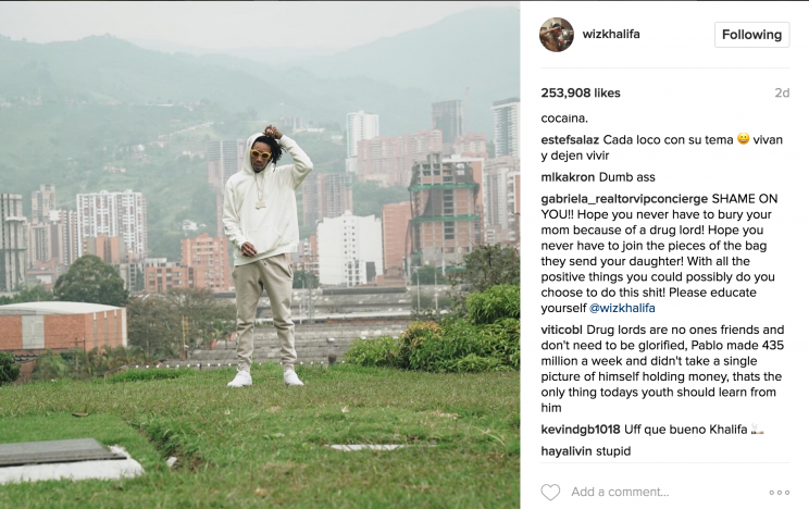 Screenshot of Wiz Khalifa's Instagram picture of him smoking near Escobar's grave.