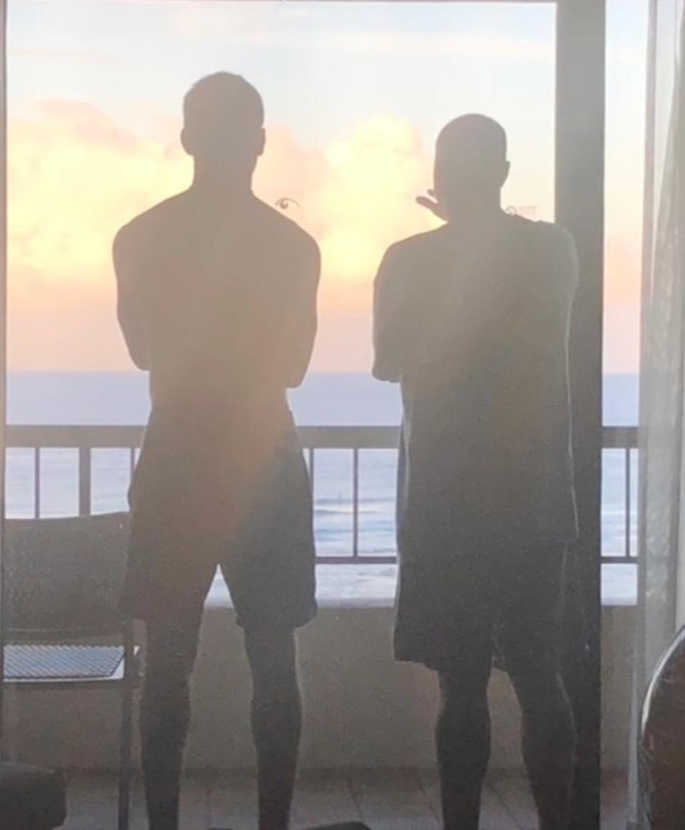 Austin and his father looking at the sunset (Family handout)