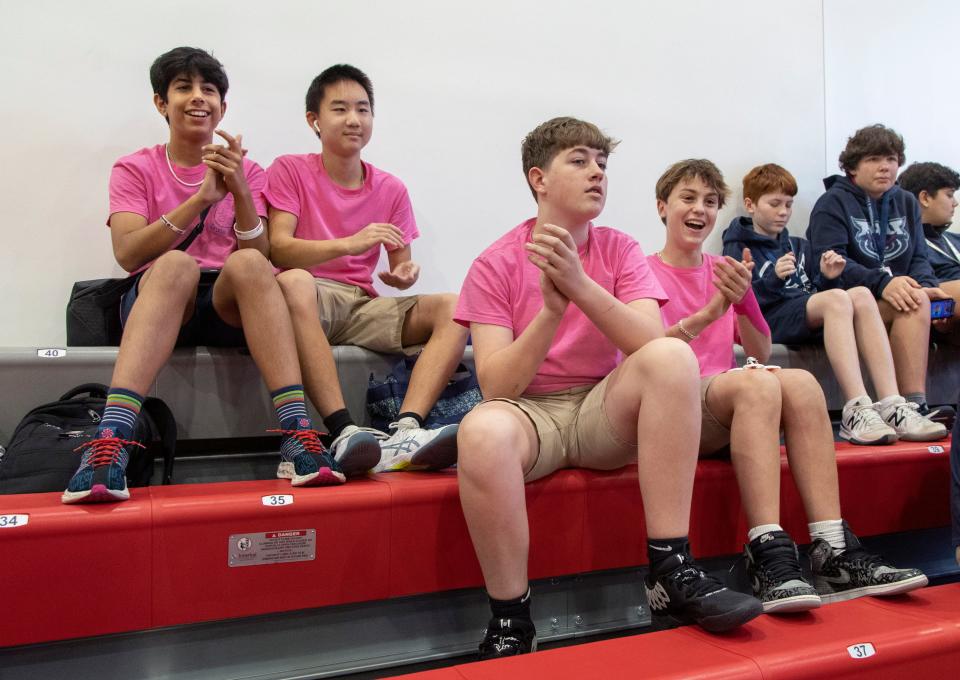 Arish Dotiwala, left to right, Andrew Liu, Preston Hoover and Ben Slive applaud racers during a drone flying competition at the A.D. Henderson & FAU High School Gymnasium on January 19, 2024 in Boca Raton, Florida. The competition was sponsored by Florida Power & Light Company and its education partner, Drones in School, an after-school program that encourages students to pursue STEM careers.