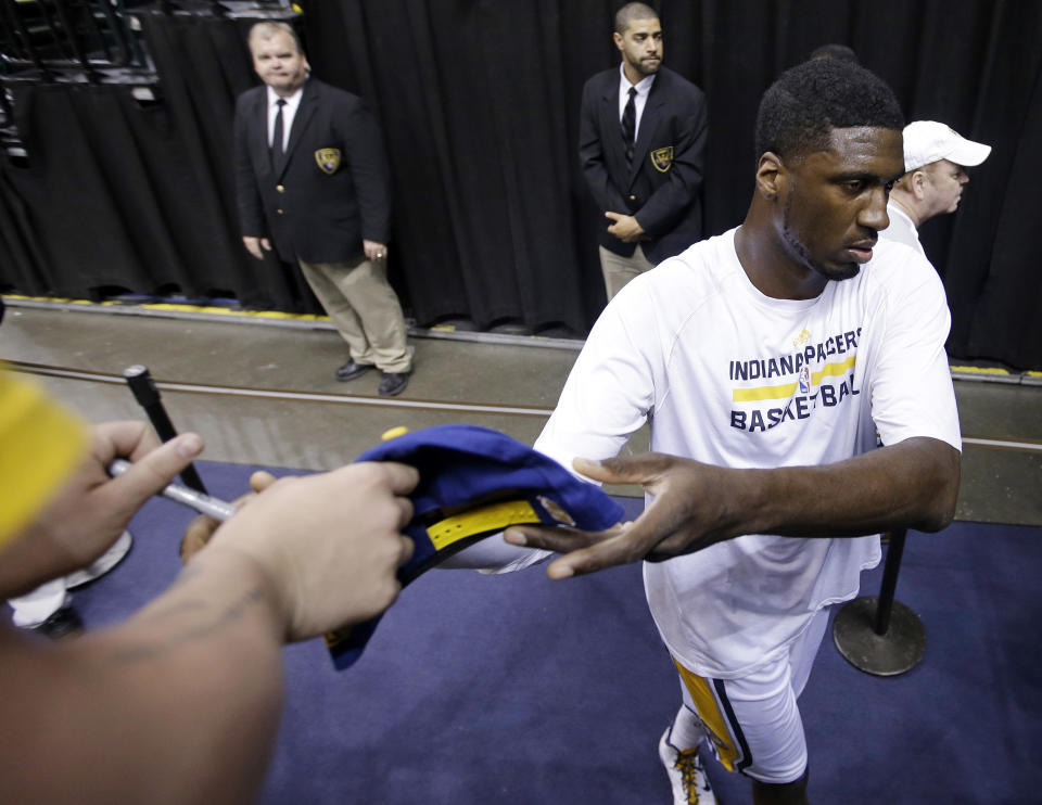 Indiana Pacers' Roy Hibbert signs an autograph for a fan before game 2 of the Eastern Conference semifinal NBA basketball playoff series against the Washington Wizards on Wednesday, May 7, 2014, in Indianapolis. (AP Photo/Darron Cummings)