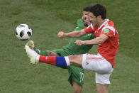 <p>Saudi Arabia’s midfielder Taisir Al-Jassim (L) and Russia’s midfielder Yury Zhirkov compete for the ball during the Russia 2018 World Cup Group A football match between Russia and Saudi Arabia at the Luzhniki Stadium in Moscow on June 14, 2018. (Photo by Juan Mabromata / AFP) / RESTRICTED TO EDITORIAL USE – NO MOBILE PUSH ALERTS/DOWNLOADS (Getty Images) </p>