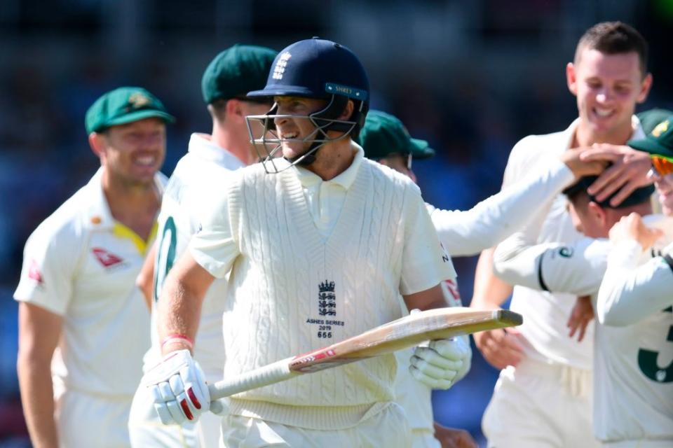 England's captain Joe Root walks back to the pavilion after getting out for 0 runs on the second day of the third Ashes cricket Test match between England and Australia at Headingley in Leeds, northern England, on August 23, 2019. (Photo by Paul ELLIS / AFP)