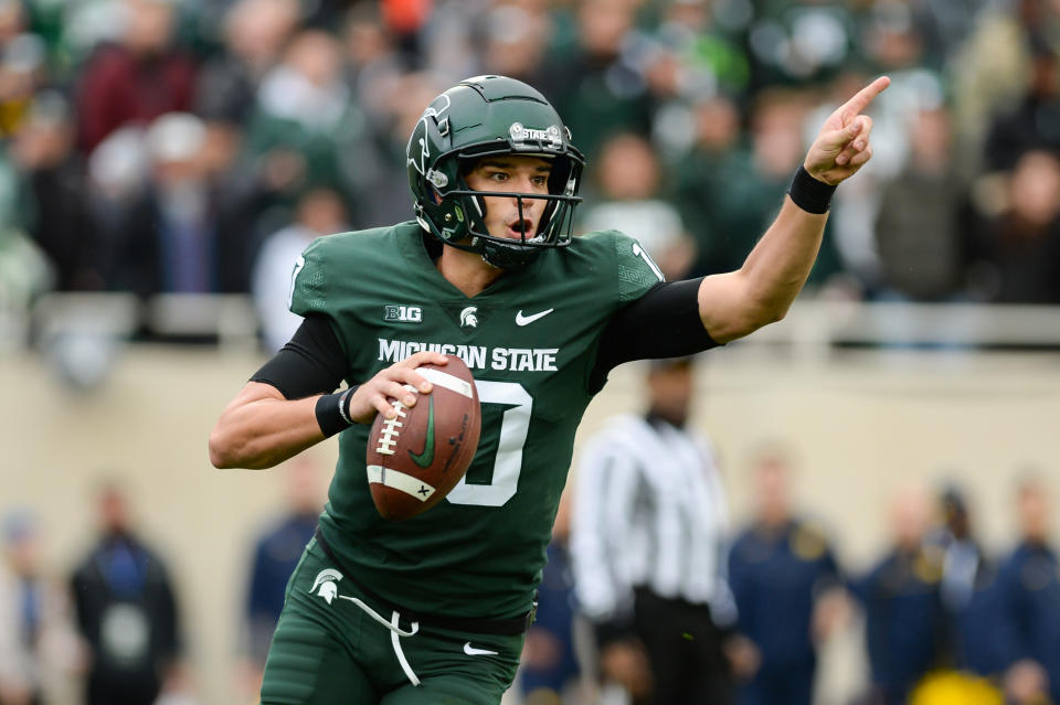 EAST LANSING, MI - OCTOBER 30: Michigan State Spartans quarterback Payton Thorne (10) motions for a teammate to pass to during a college football game between the Michigan State Spartans and the Michigan Wolverines on October 30, 2021 at Spartan Stadium in East Lansing, MI. (Photo by Adam Ruff/Icon Sportswire via Getty Images)