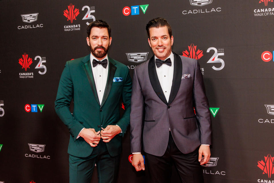 TORONTO, ONTARIO - DECEMBER 02: (L-R) Co-hosts Drew Scott and Jonathan Scott of Property Brothers attend Canada's Walk of Fame's 25th Anniversary Celebration at Metro Toronto Convention Centre on December 02, 2023 in Toronto, Ontario. (Photo by Mathew Tsang/WireImage)