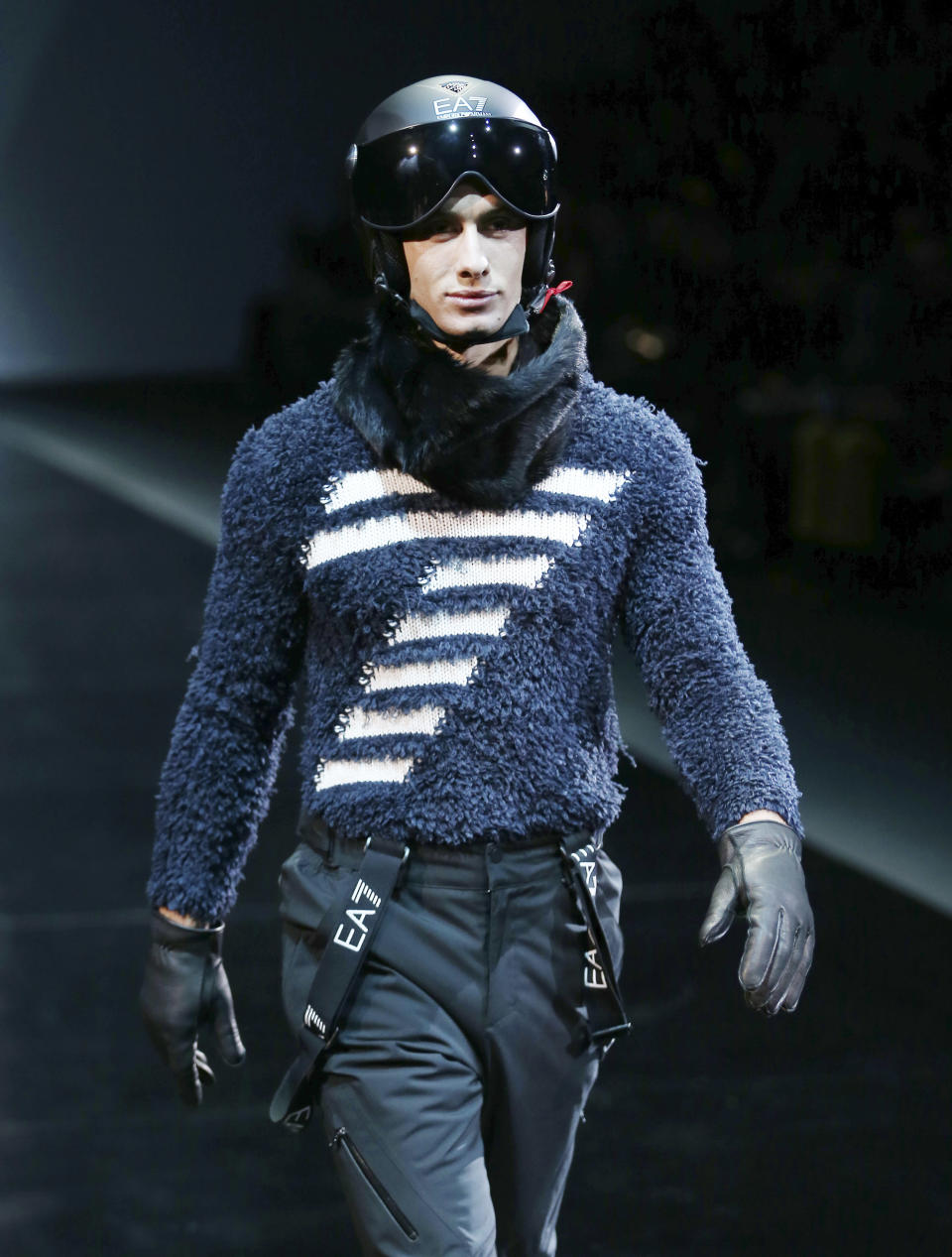 A model wears a creation for Emporio Armani men's Fall-Winter 2014 collection, part of the Milan Fashion Week, unveiled in Milan, Italy, Monday, Jan. 13, 2014. (AP Photo/Antonio Calanni)