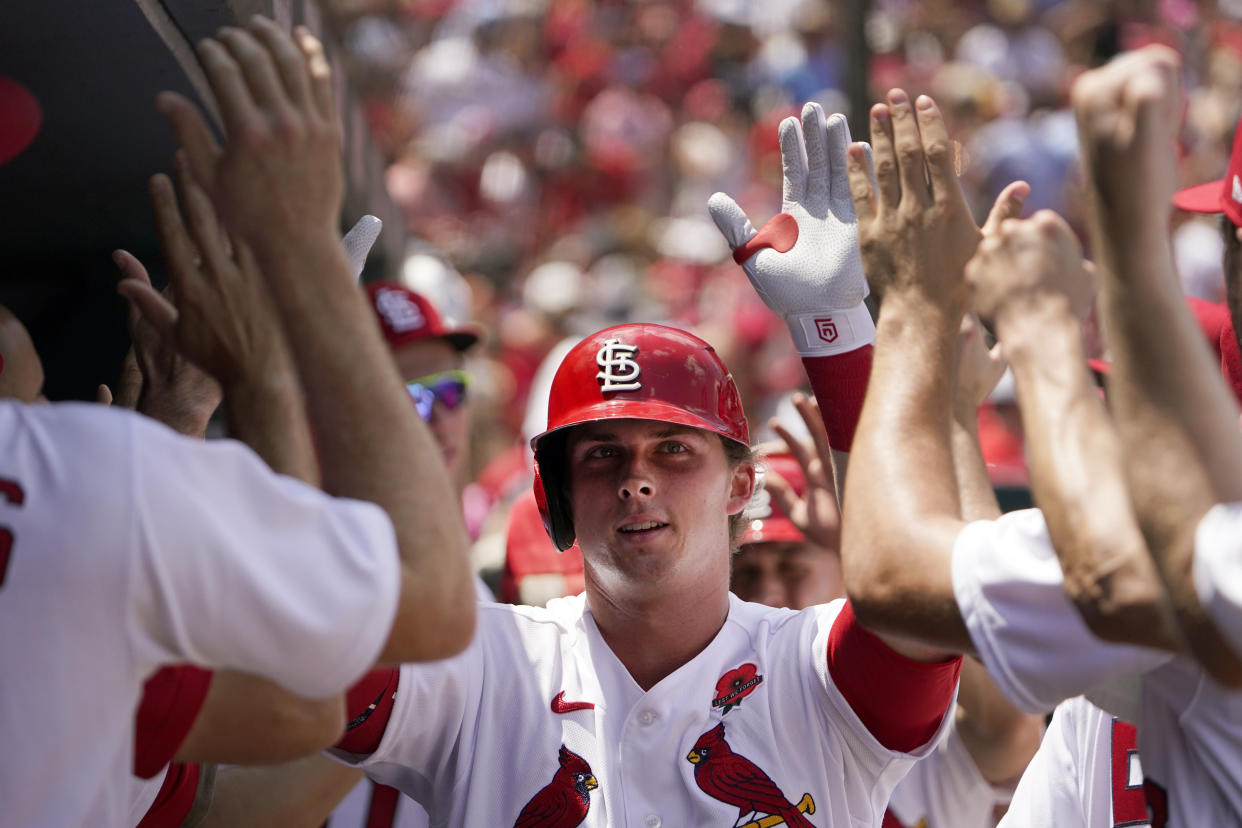 St. Louis Cardinals rookie Nolan Gorman is congratulated by teammates after hitting a two-run home run. (AP Photo/Jeff Roberson)