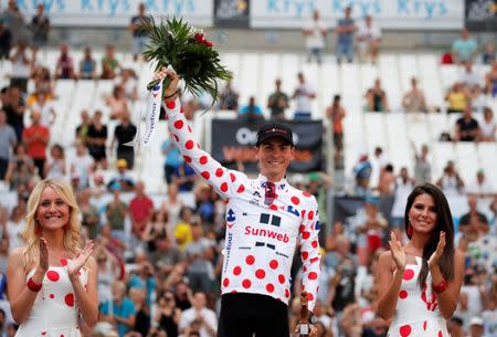 Cycling - The 104th Tour de France cycling race - The 22.5-km individual time trial Stage 20 from Marseille to Marseille, France - July 22, 2017 - Team Sunweb rider Warren Barguil of France celebrates on the podium, wearing the polka-dot jersey. REUTERS/Benoit Tessier