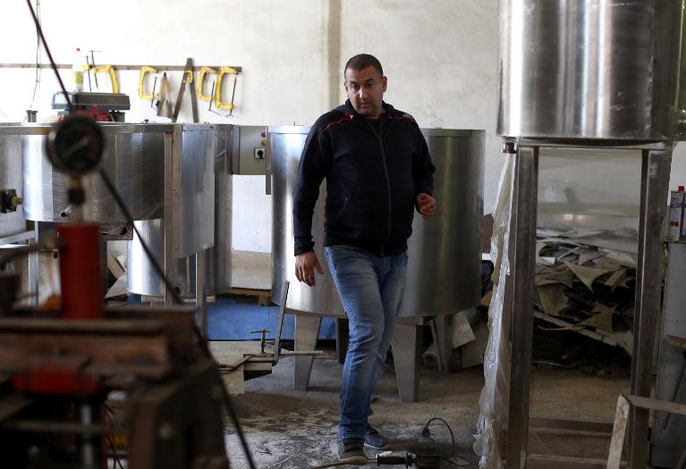 Algerian entrepreneur Nassim Aoudia stands in one of his workshops in the city of Borj al-Bahri, 24km East of the capital Algiers, on April 15, 2014