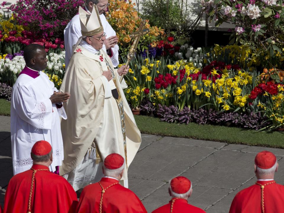 Flowers from the Netherlands decorate St. Peter's Square as Pope Francis arrives to celebrate an Easter Mass in St. Peter's Square at the the Vatican, Sunday, April 20, 2014. Francis is celebrating Christianity's most joyous day, Easter Sunday, under sunny skies in St. Peter's. (AP Photo/Alessandra Tarantino)