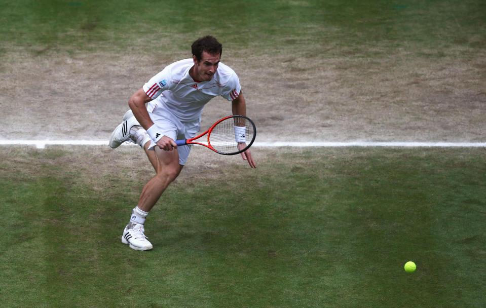 Andy Murray of Great Britain runs for the ball during his Gentlemen's Singles final match against Roger Federer at Wimbledon.