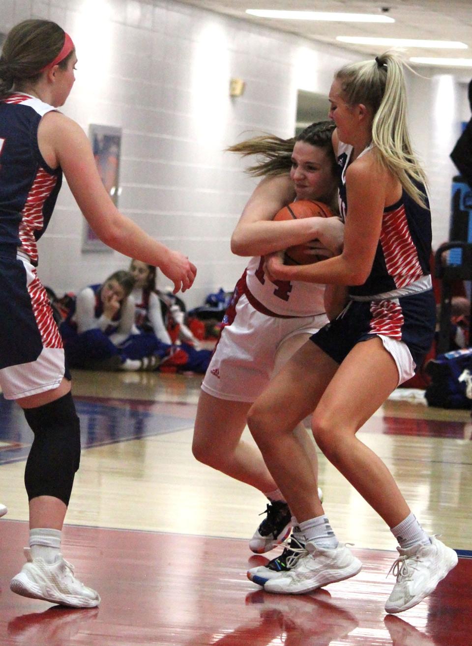 Martinsville senior Mackenzie Martin (left) fights for the ball during Thursday's home game against Bedford North Lawrence. 