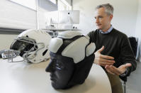 In this photo taken May 23, 2019, Dave Marver, CEO of VICIS, a Seattle-based company that makes football helmets, talks in Seattle about his company's latest offering, the ULTIM cap. VICIS announced on Monday, July 1, the cap is intended for use with youth flag football and the quickly expanding competitive 7-on-7 football played during the offseason for youth and high school programs. (AP Photo/Ted S. Warren). (AP Photo/Ted S. Warren)