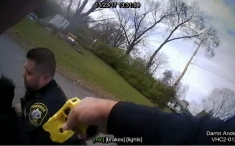A police officer aims a Taser  - Credit: APTN / RIVERSIDE POLICE DEPARTMENT VIA WHIO