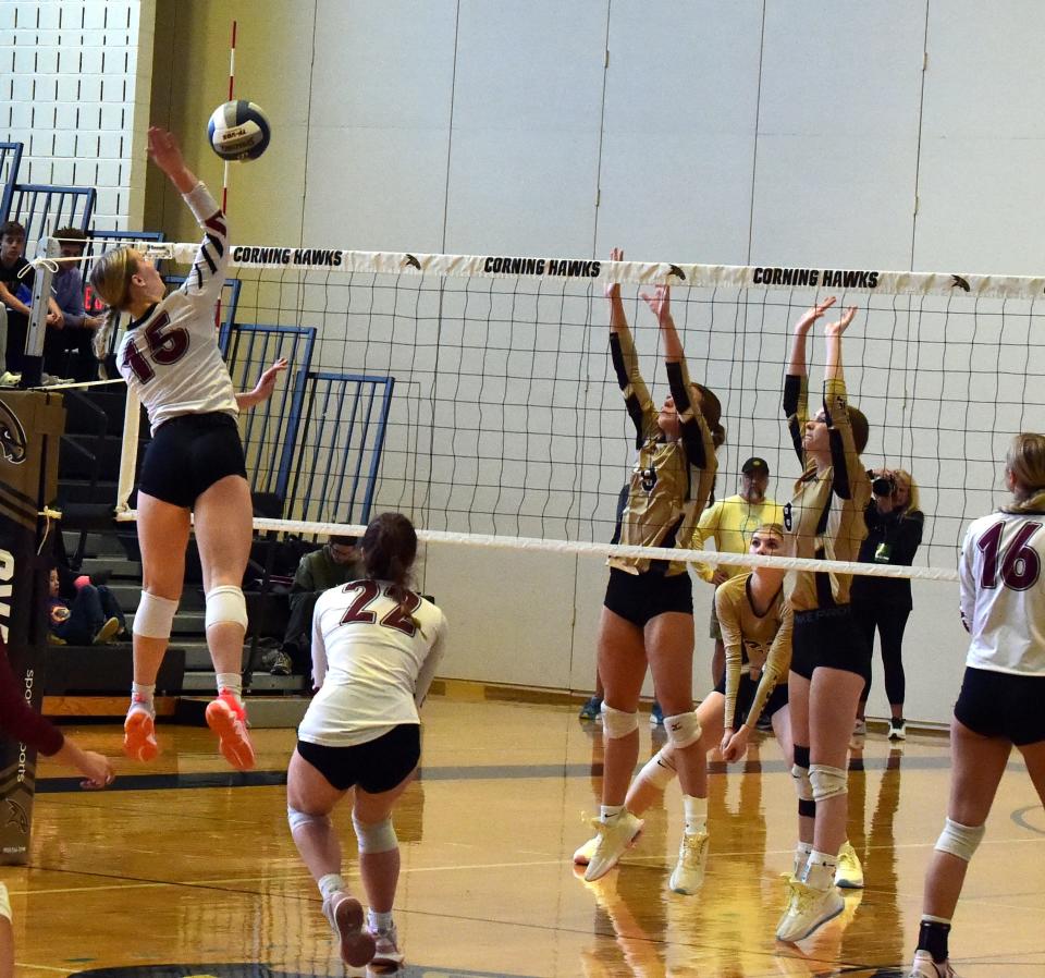 Elmira's Piper Hooey (15) goes up for a spike in a 3-2 win over Corning in the Section 4 Class AAA volleyball final Nov. 4, 2023 at Corning-Painted Post High School.