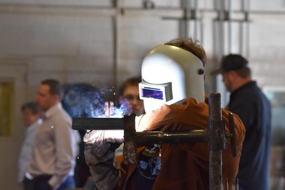 A Rockport-Fulton High School student welds in the school's welding lab, which is set to be renovated with funds from a Texas Workforce Commission grant program.