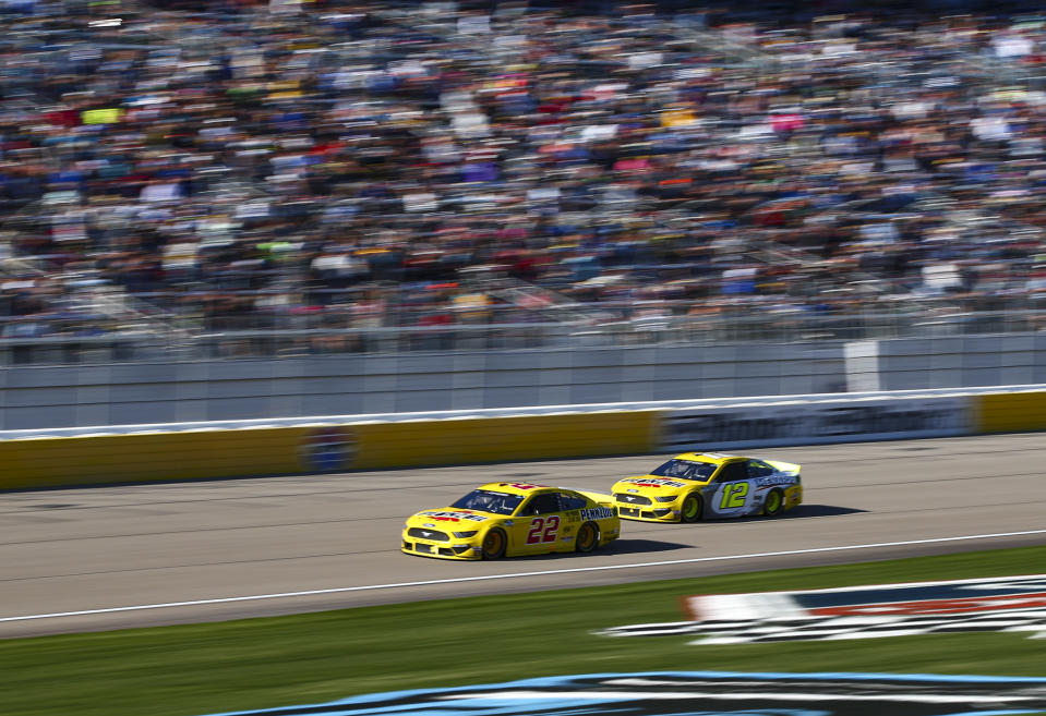 Joey Logano (22) and Ryan Blaney (12) drive during a NASCAR Cup Series auto race at the Las Vegas Motor Speedway on Sunday, Feb. 23, 2020. (AP Photo/Chase Stevens)