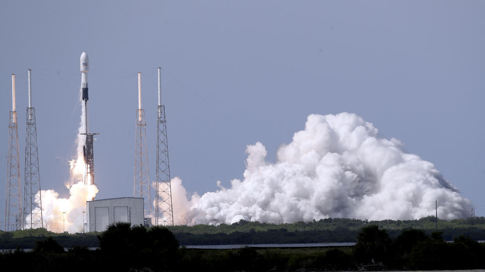 A Falcon 9 SpaceX rocket, with a global positioning satellite for the U.S. Space Force, lifts off from launch complex 40 at the Cape Canaveral Air Force Station in Cape Canaveral, Fla., Tuesday, June 30, 2020. (AP Photo/John Raoux)