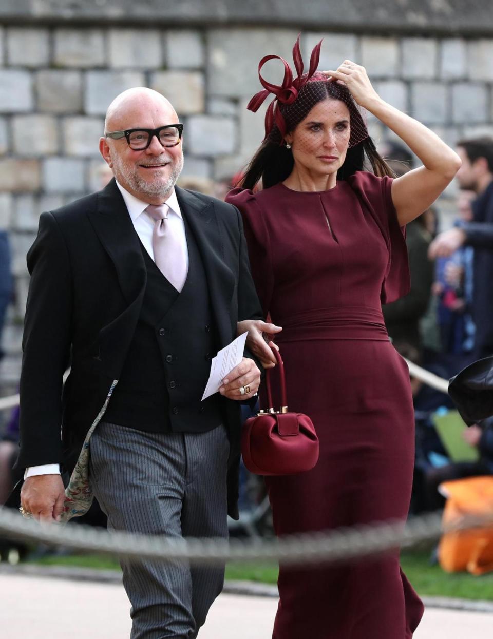 Demi Moore arrives in a maroon dress (PA Wire/PA Images)