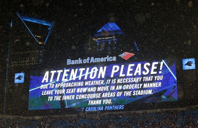 Aug. 13, 2011 - Charlotte, North Carolina, U.S - Carolina Panthers fans  cheer as the rain finally stops during the preseason game.Panthers defeat  the Giants 20-10 at the Bank of America Stadium