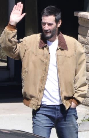 <p>BACKGRID</p> Keanu Reeves is photographed with a sharp crew cut on the set of Outcome