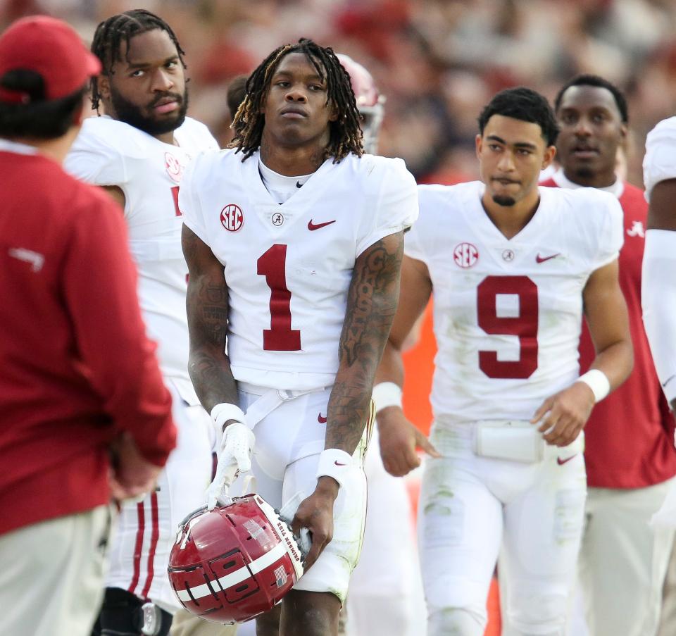 Nov 27, 2021; Auburn, Alabama, USA;  Alabama wide receiver Jameson Williams (1) reacts after being ejected for targeting on a special teams play against Auburn at Jordan-Hare Stadium. Mandatory Credit: Gary Cosby Jr.-USA TODAY Sports