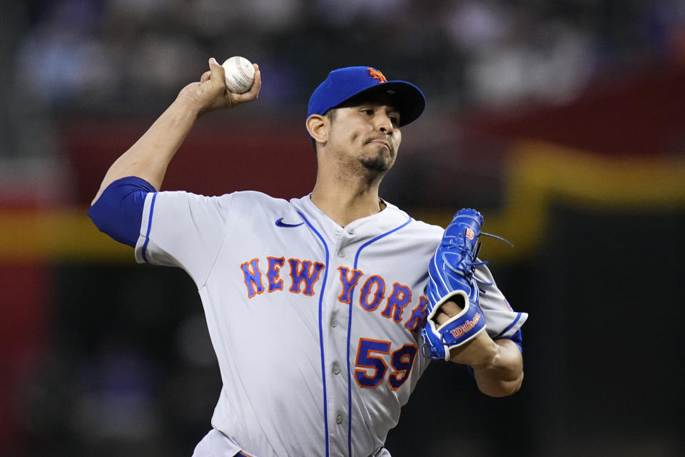 New York Mets starting pitcher Carlos Carrasco throws against the Arizona Diamondbacks during the first inning of a baseball game Thursday, July 6, 2023, in Phoenix. (AP Photo/Ross D. Franklin)