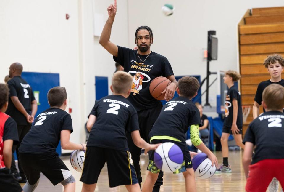 NBA player Gabe Vincent leads a drill during the Modesto Slam-N-Jam Youth Basketball Camp at Modesto Junior College in Modesto, Calif., Friday, July 7, 2023.