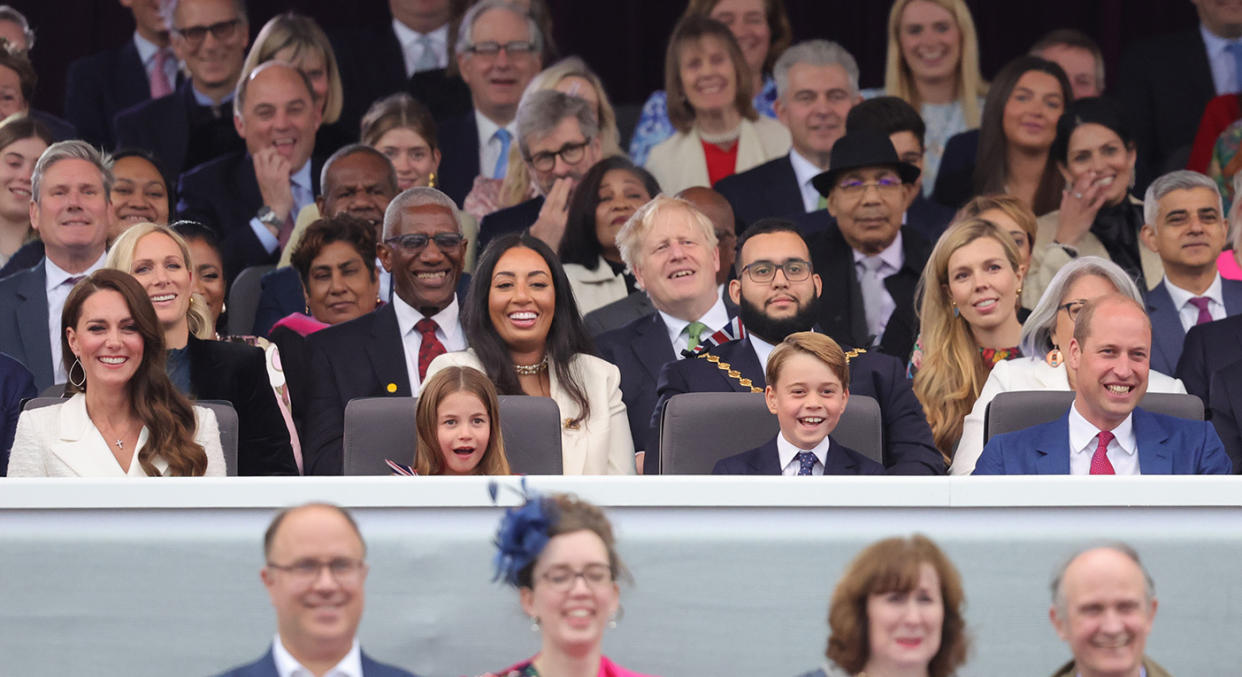 The Cambridge family were all smiles as they joined the rest of the Royal Family for the Party at the Palace performance. (Getty Images)