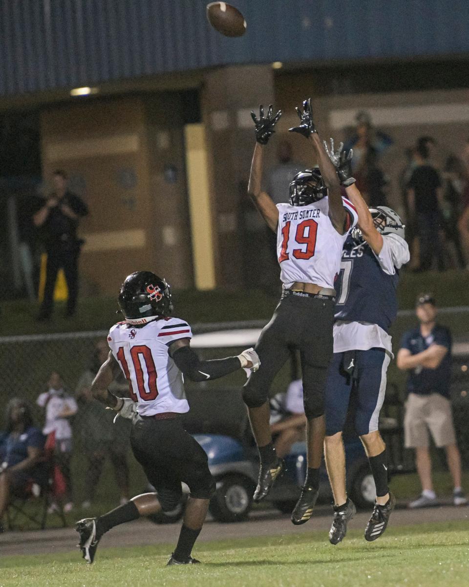 South Sumter's George Mullins (19) tries to intercept a pass intended for South Lake's Maxwell Fogel (7) during a game between South Lake High School and South Sumter High School in Groveland on Thursday, Sept. 2, 2021. (PAUL RYAN / CORRESPONDENT)