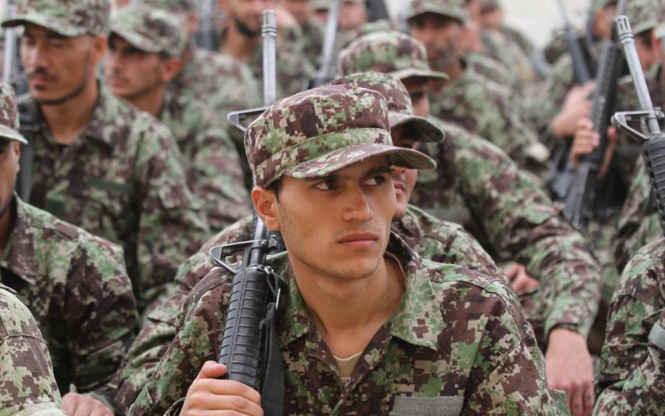 Afghan National Army (ANA) soldiers attend the graduation ceremony, from the 207 Zafar Corps training center in Herat, Afghanistan, 05 May 2021 - JALIL REZAYEE/Shutterstock 