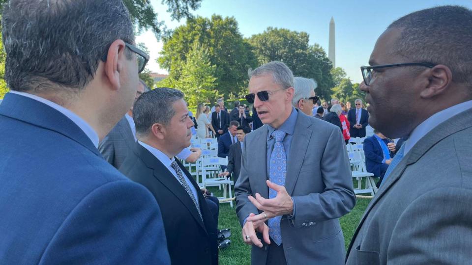 Intel CEO Pat Gelsinger (center-right) speaks Tuesday with U.S. Sen. Ben Ray Luján of New Mexico before a bill signing ceremony for the U.S. CHIPS and Science Act at the White House in Washington, D.C. Also pictured are Keyvan Esfarjani (left), chief global operations officer at Intel, and Al Thompson (right), vice president of U.S. Government Relations at Intel.