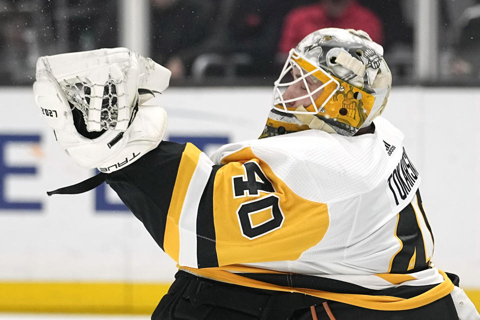 Pittsburgh Penguins goaltender Dustin Tokarski makes a glove save during the second period of an NHL hockey game against the Los Angeles Kings Saturday, Feb. 11, 2023, in Los Angeles. (AP Photo/Mark J. Terrill)