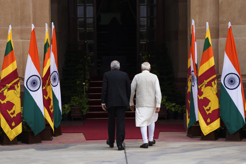 Indian Prime Minister Narendra Modi walks with Sri Lankan President Ranil Wickremesinghe before their delegation level meeting in New Delhi, India, Friday, July 21, 2023. (AP Photo/Manish Swarup)
