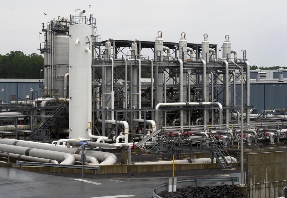 FILE - A heat exchanger and transfer pipes at Dominion Energy's Cove Point LNG Terminal in Lusby, Md., June 12, 2014. The Biden administration is delaying consideration of new natural gas export terminals in the United States, even as gas shipments to Europe and Asia have soared since Russia’s invasion of Ukraine. (AP Photo/Cliff Owen, File)