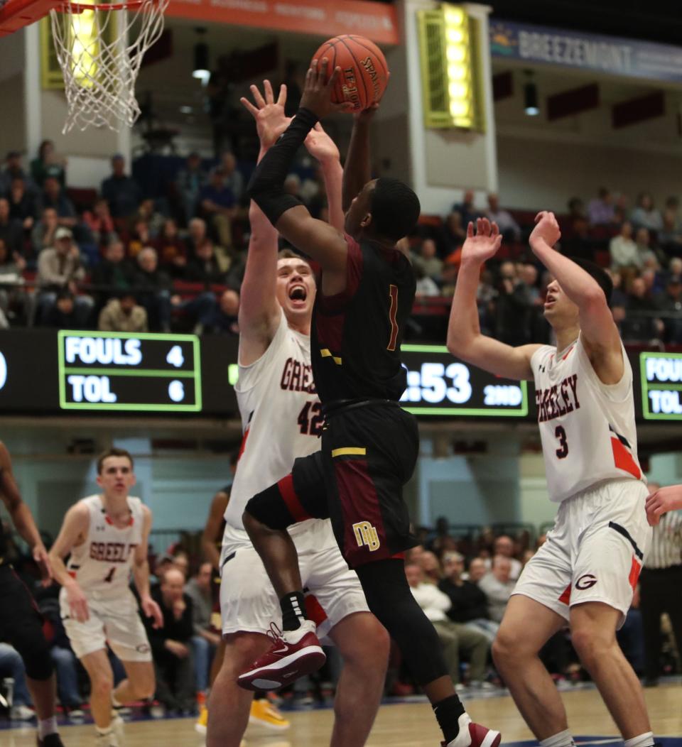 Horace Greeley's Nick Townsend (42) puts a block on Mount Vernon's Ervin Patrick (1) during their 46-35 win over Mount Vernon in the boys basketball Class AA section championship game at the Westchester County Center in White Plains on Sunday, March 8, 2020. 