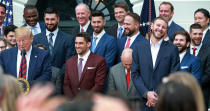 President Donald Trump (left) is pictured with members of the Boston Red Sox during a ceremony honoring the 2018 World Series Champions held on the South Lawn of the White House. Red Sox pitcher Chris Sale (left) reacts as trump sings his praises about his effort the night before in Baltimore vs. the Orioles. (Jim Davis/Boston Globe via Getty Images).