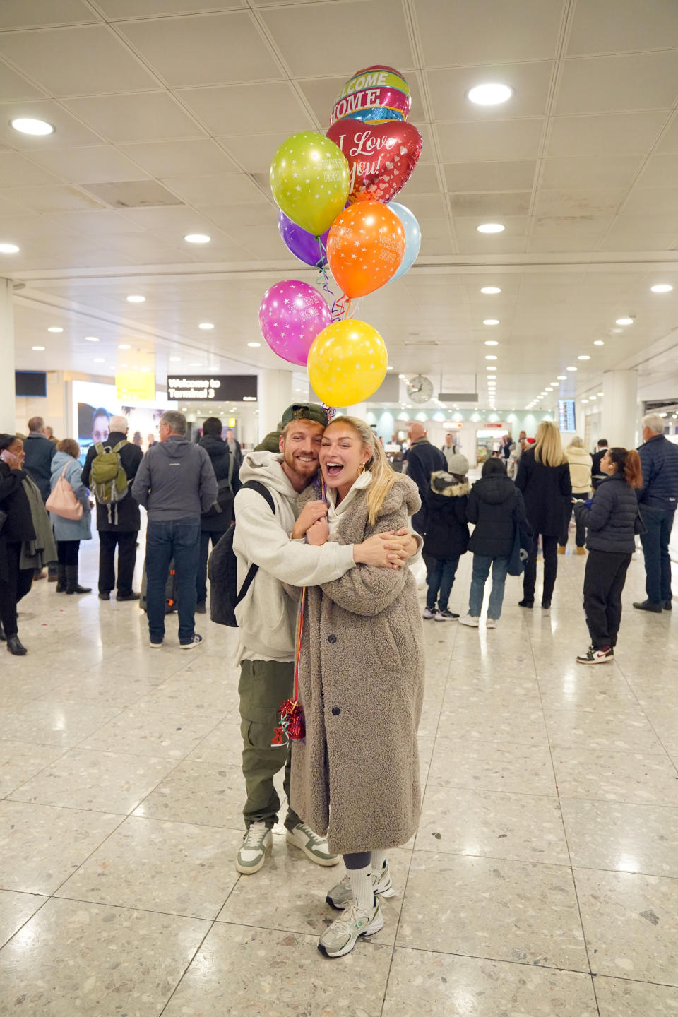 Series winner Sam Thompson (left) is greeted by Zara McDermott at Heathrow Airport in London after competing in ITV's I'm a Celebrity Get Me Out Of Here! in Australia. Date taken: Wednesday December 13, 2023. (Photo by Jonathan Brady/PA Images via Getty Images)