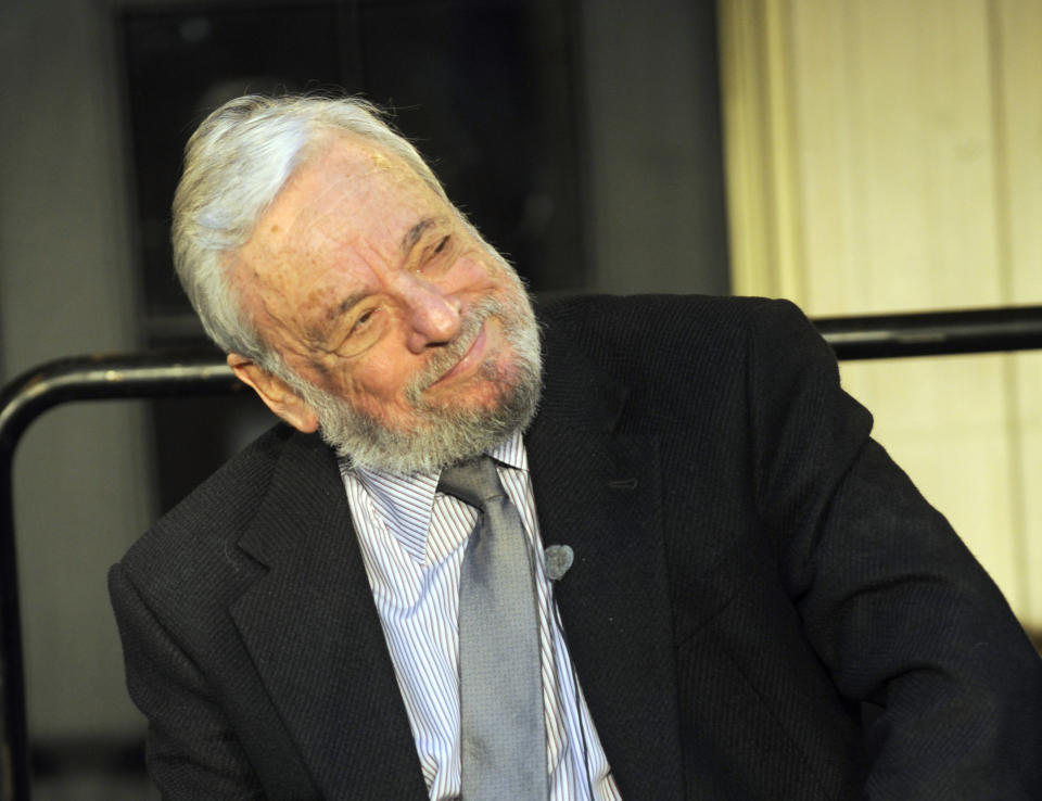 FILE - In a Wednesday, Sept. 15, 2010 file photo, Stephen Sondheim listens to Nathan Lane before the lighting of the marquee of the Stephen Sondheim Theatre on West 43rd St. in Times Square, in New York. Sondheim and Paul Simon made a joint stage appearance Tuesday night, Dec. 3, 2013, at a small auditorium in downtown Manhattan. Their one-hour conversation was sponsored by the MacDowell artist colony. (AP Photo/Henny Ray Abrams. File)