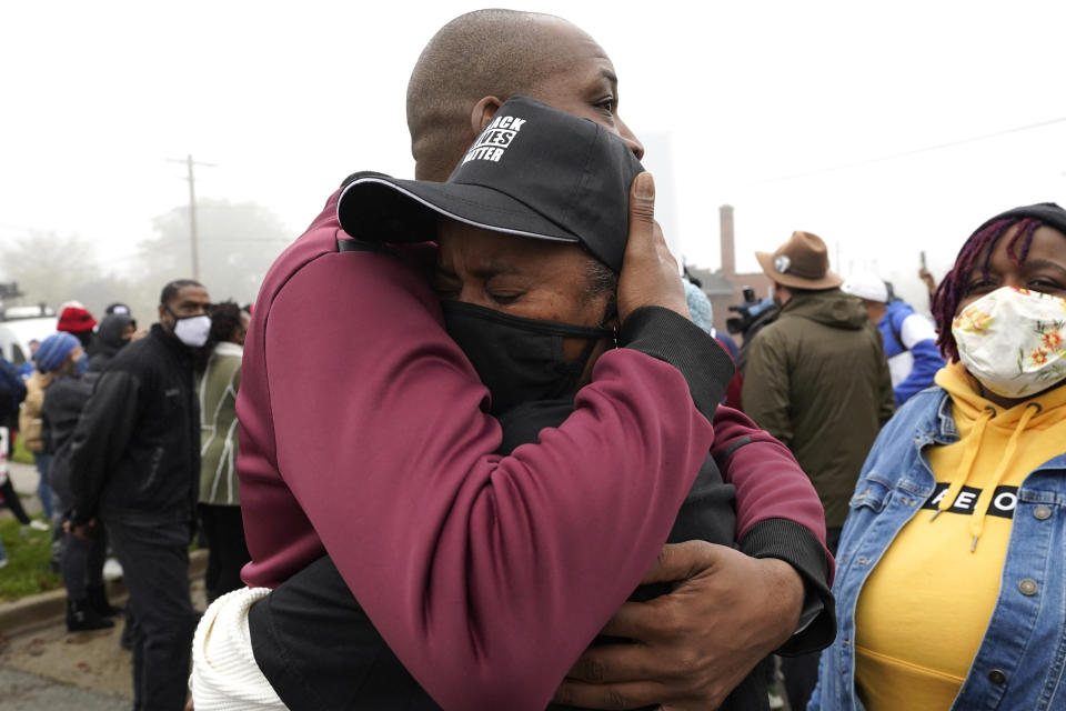 Marcellis Stinnette's grandmother Sherrellis Stinnette, right, cries as she hugs Rayon Edwards during protest rally for Marcellis Stinnette who killed by Waukegan Police Tuesday in Waukegan, Ill., Thursday, Oct. 22, 2020. Stinnette, 19, was killed and his girlfriend and the mother of his child, Tafara Williams, was wounded when a police officer in Waukegan opened fire Tuesday night after police said Williams' vehicle started rolling toward the officer following a traffic stop. (AP Photo/Nam Y. Huh)