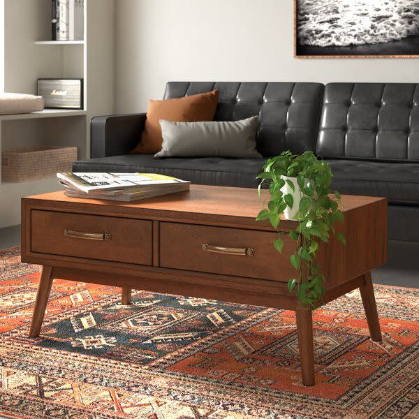 <p><strong>Wade Logan</strong></p><p>wayfair.com</p><p><strong>$346.99</strong></p><p>A coffee table should anchor your living room while complimenting the rest of your furniture and decor focal points. This rich wood table is timeless and subdued, so it'll mesh well with your existing decor. Bonus points for two large storage drawers and a nearly perfect 4.8-star rating from reviewers! </p>