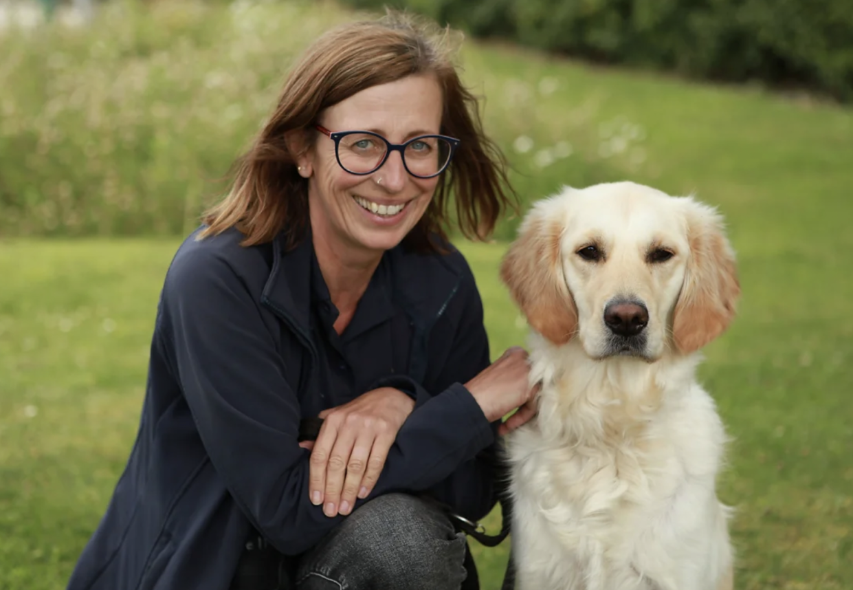  Puppy School for Guide Dogs promo image featuring a smiling woman and a fluffy Labrador Retriever 