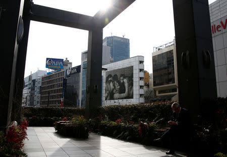 A signboard featuring picture of APA hotel chain's president Fumiko Motoya on its headquarters building is pictured in Tokyo, Japan, January 19, 2017. REUTERS/Kim Kyung-Hoon