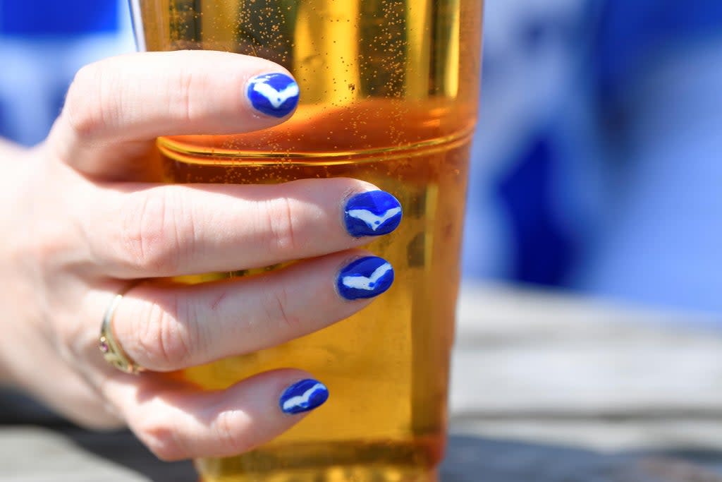 A Brighton fan with a beer  (REUTERS)