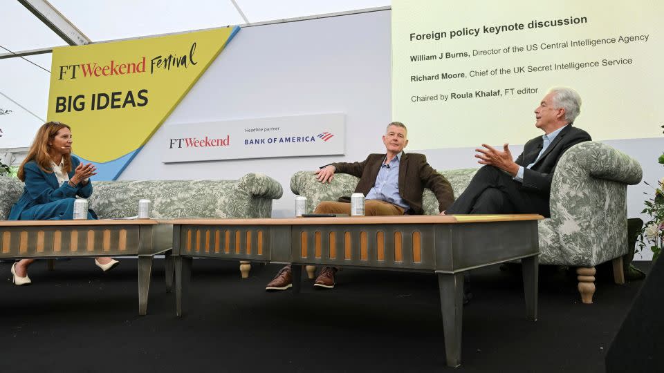 MI6 chief Richard Moore, center, and CIA director Bill Burns, right, are interviewed by Roula Khalaf, editor of the Financial Times, on Saturday. - Em Fitzgerald/Pool/Reuters