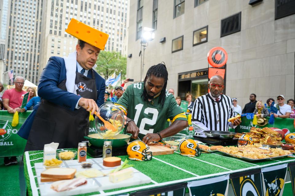 Green Bay-area Chef Ace Champion makes grilled cheese sandwiches on the TODAY Show with Carson Daly, (left), and Al Roker (far right) on Sept. 5, 2019. In August of 2020, he returned to the show and, along with 69 other chefs, set a Guinness World Record by participating in "Rokerthon Sandwich Relay." (Photo by: Nathan Congleton/NBC/NBCU Photo Bank)