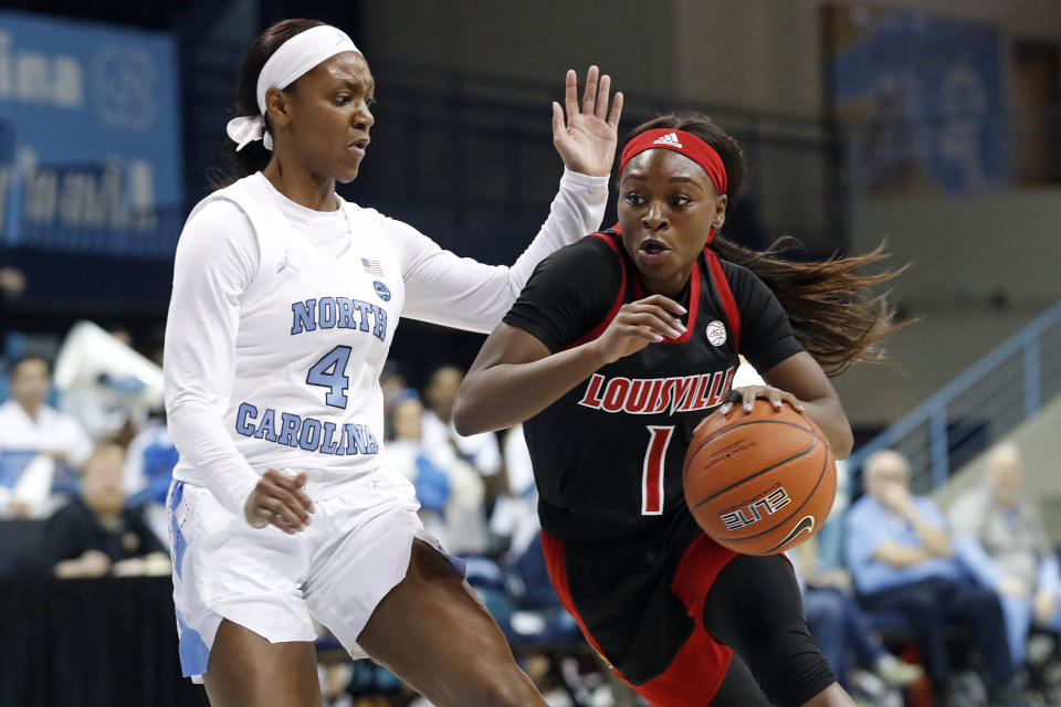 North Carolina guard Kennady Tucker (4) guards against Louisville guard Dana Evans (1) during the first half of an NCAA college basketball game in Chapel Hill, N.C., Sunday, Jan. 19, 2020. (AP Photo/Gerry Broome)