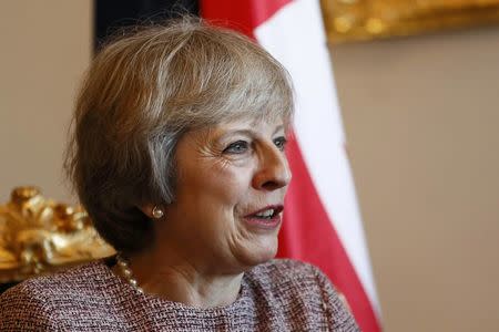 Britain's Prime Minister Theresa May speaks with Oman's Deputy Prime Minister, Fahad bin Mahmood at the Oman villa in Manama, Bahrain December 7, 2016.REUTERS/Stefan Wermuth