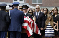 FILE - In this June 6, 2015, file photo, then-Vice President Joe Biden watches an honor guard carry a casket containing the remains of his son, former Delaware Attorney General Beau Biden, into St. Anthony of Padua Roman Catholic Church in Wilmington, Del. Standing alongside the vice president are Beau's widow Hallie Biden, left, and daughter, Natalie. Beau Biden died of brain cancer May 30 at age 46. (AP Photo/Patrick Semansky, File)