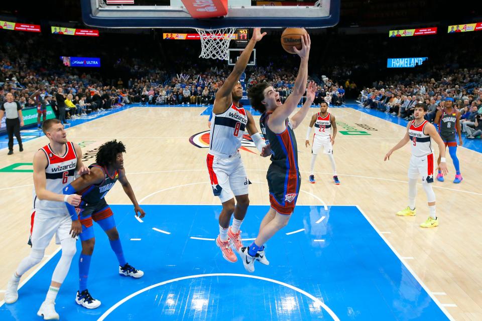 Oklahoma City Thunder guard Josh Giddey (3) goes to the bucket past Washington Wizards forward Rui Hachimura (8)  during an NBA basketball game between the Oklahoma City Thunder and the Washington Wizards at Paycom Center, Friday, Jan. 6, 2023. 